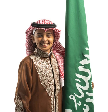 image-69370-portrait-saudi-arabian-gulf-boy-holding-saudi-flag-wearing-thumbnail